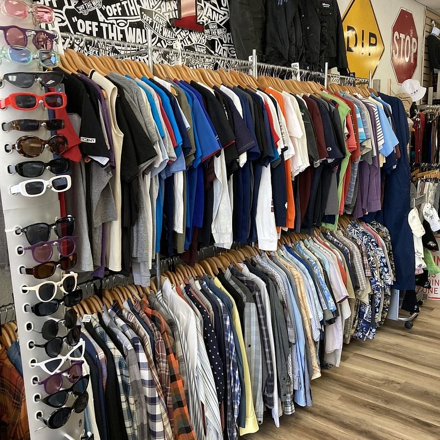 best thrift store hauls San Diego vintage clothing home decor Levis jeans mid-century modern chair designer handbag record player